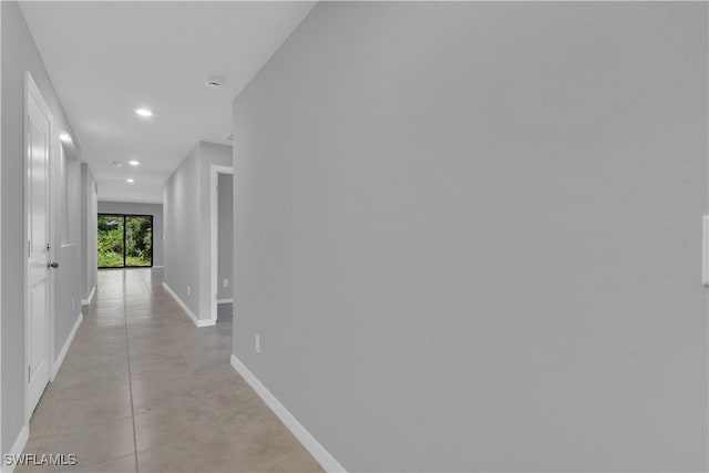 23206 Fitzpatrick Ave, Port Charlotte, FL 33980 - hallway featuring recessed lighting and baseboards