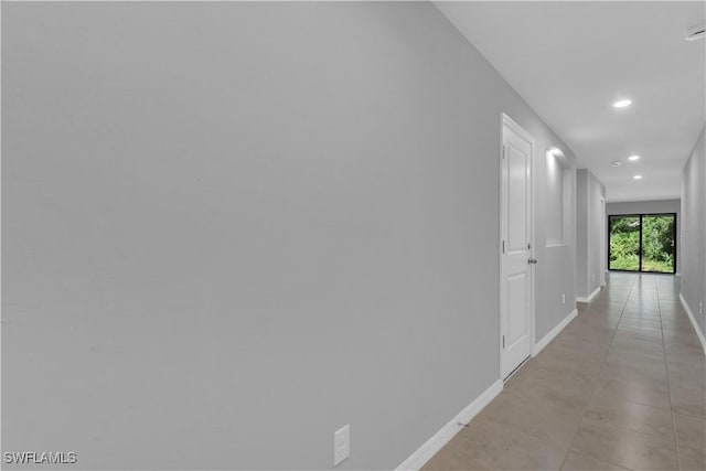 23206 Fitzpatrick Ave, Port Charlotte, FL 33980 - hall with baseboards and recessed lighting