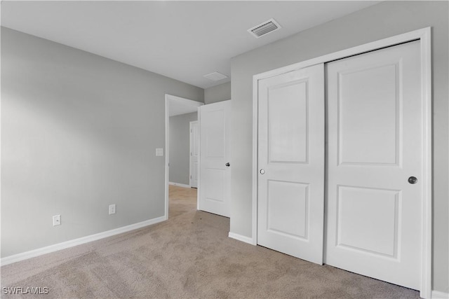 23206 Fitzpatrick Ave, Port Charlotte, FL 33980 - unfurnished bedroom with carpet flooring, baseboards, and a closet