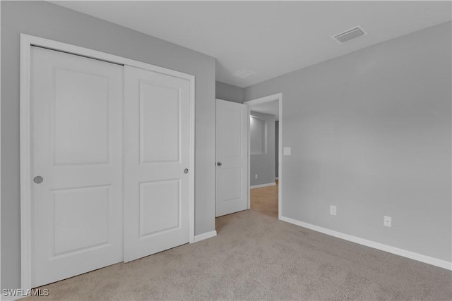 23206 Fitzpatrick Ave, Port Charlotte, FL 33980 - unfurnished bedroom featuring carpet, baseboards, and a closet