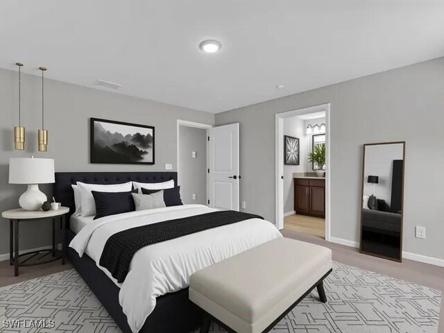 23206 Fitzpatrick Ave, Port Charlotte, FL 33980 - bedroom featuring baseboards and ensuite bath