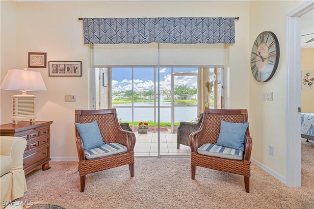 14971 Vista View Way Unit 1003, Fort Myers, FL 33919 - living area featuring carpet flooring, a water view, baseboards, and a towering ceiling