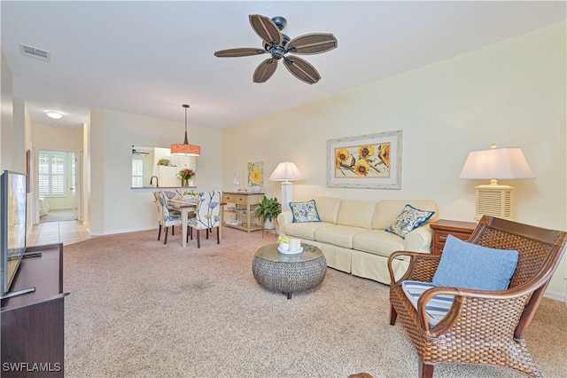 14971 Vista View Way Unit 1003, Fort Myers, FL 33919 - carpeted living room featuring a ceiling fan and baseboards