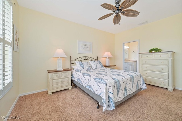 14971 Vista View Way Unit 1003, Fort Myers, FL 33919 - bedroom with light carpet, baseboards, ensuite bath, and ceiling fan