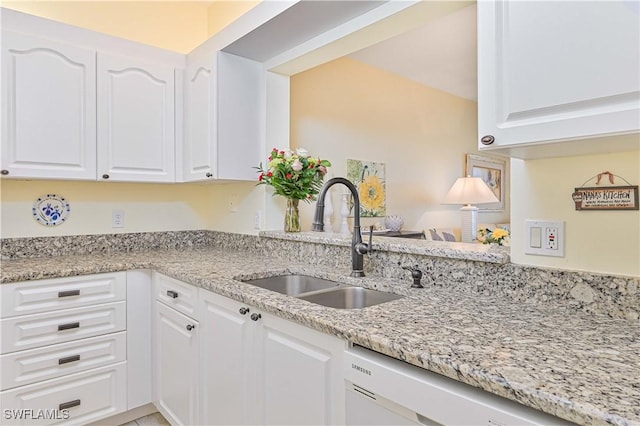 14971 Vista View Way Unit 1003, Fort Myers, FL 33919 - kitchen with a sink, white dishwasher, white cabinets, and light stone counters