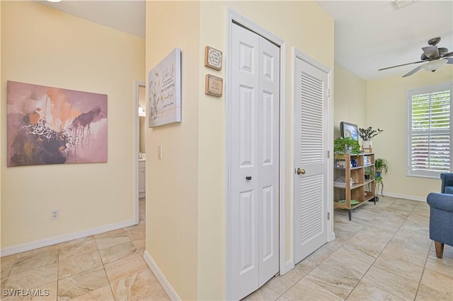 14971 Vista View Way Unit 1003, Fort Myers, FL 33919 - corridor with light marble finish floors and baseboards