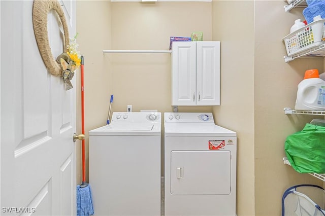 14971 Vista View Way Unit 1003, Fort Myers, FL 33919 - laundry room with cabinet space and washing machine and clothes dryer