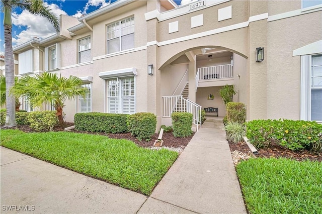14971 Vista View Way Unit 1003, Fort Myers, FL 33919 - property entrance with stucco siding