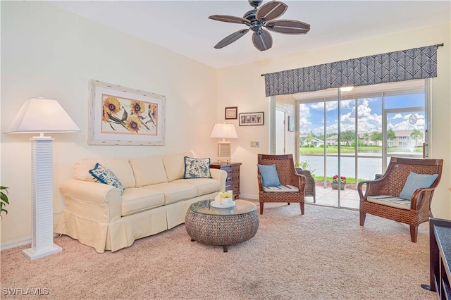 14971 Vista View Way Unit 1003, Fort Myers, FL 33919 - carpeted living room with a ceiling fan, a water view, and baseboards