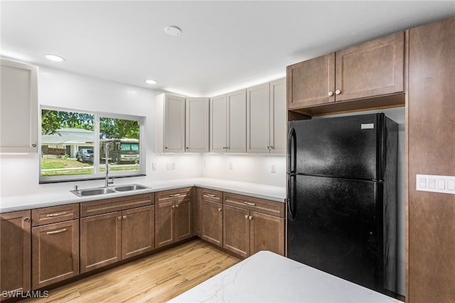 16351 Karen Way N, Fort Myers, FL 33917 - kitchen featuring freestanding refrigerator, light wood-style flooring, a sink, light countertops, and recessed lighting
