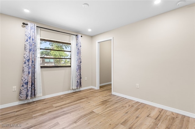 16351 Karen Way N, Fort Myers, FL 33917 - unfurnished room with light wood-style floors, baseboards, a smoke detector, and recessed lighting