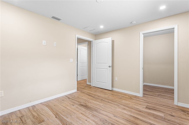 16351 Karen Way N, Fort Myers, FL 33917 - unfurnished bedroom with light wood finished floors, baseboards, and recessed lighting