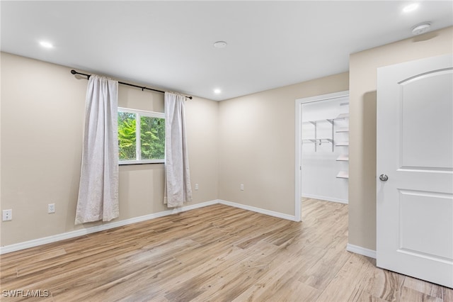 16351 Karen Way N, Fort Myers, FL 33917 - unfurnished room with light wood-style flooring, a smoke detector, baseboards, and recessed lighting