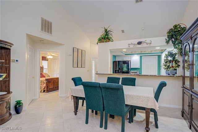 20010 Wolfel Trl, Estero, FL 33928 - dining space featuring high vaulted ceiling, baseboards, light tile patterned floors, and a ceiling fan