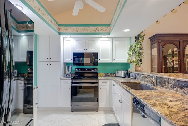 20010 Wolfel Trl, Estero, FL 33928 - kitchen with black microwave, stainless steel range with electric cooktop, a sink, dishwashing machine, and freestanding refrigerator