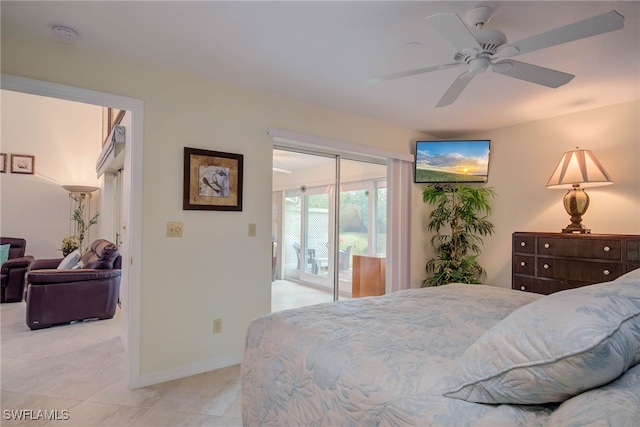 20010 Wolfel Trl, Estero, FL 33928 - bedroom featuring access to exterior, light tile patterned floors, a ceiling fan, and baseboards