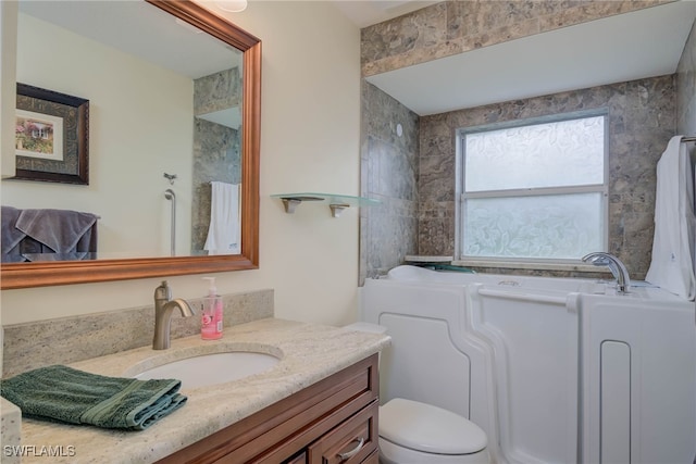 20010 Wolfel Trl, Estero, FL 33928 - full bath with vanity, a garden tub, and toilet