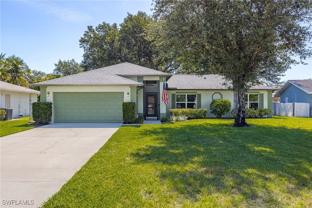 3272 Red Blush Way, Naples, FL 34120 - view of front of property featuring concrete driveway, stucco siding, a garage, and central AC unit