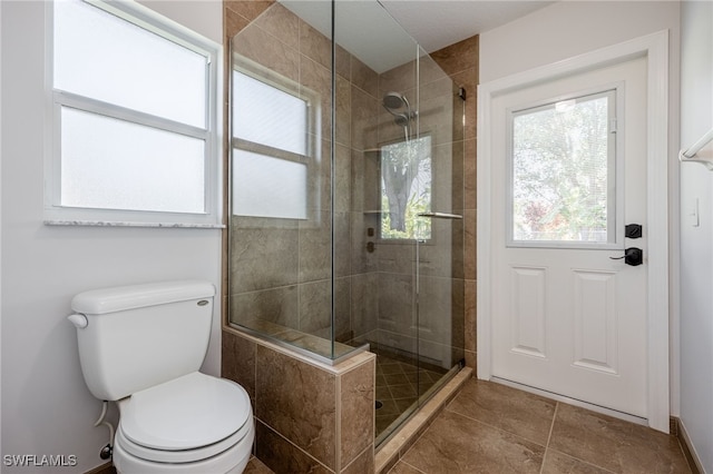 3272 Red Blush Way, Naples, FL 34120 - bathroom featuring toilet, a stall shower, and tile patterned floors