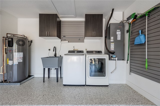 3272 Red Blush Way, Naples, FL 34120 - laundry area with washing machine and clothes dryer, cabinet space, water heater, heating unit, and baseboards