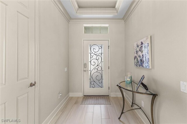 2736 Lambay Ct, Cape Coral, FL 33991 - foyer entrance with ornamental molding, a raised ceiling, and baseboards
