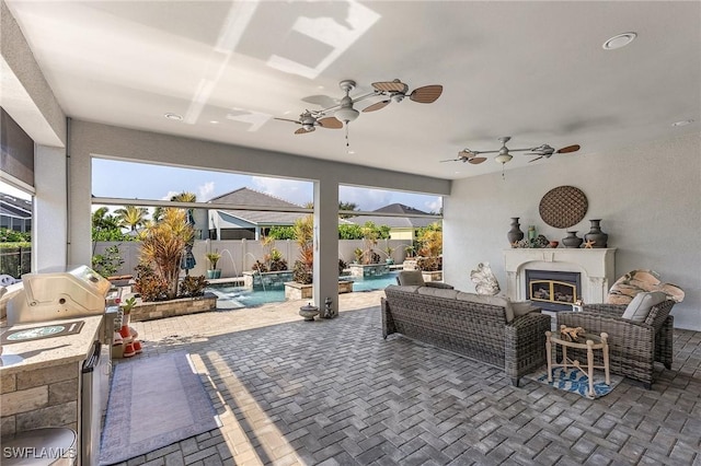 2736 Lambay Ct, Cape Coral, FL 33991 - view of patio / terrace with a fenced backyard, an outdoor living space with a fireplace, a pool with connected hot tub, a ceiling fan, and a grill