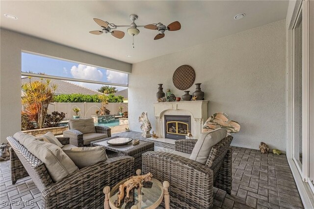 2736 Lambay Ct, Cape Coral, FL 33991 - view of patio with an outdoor living space with a fireplace, fence, and ceiling fan