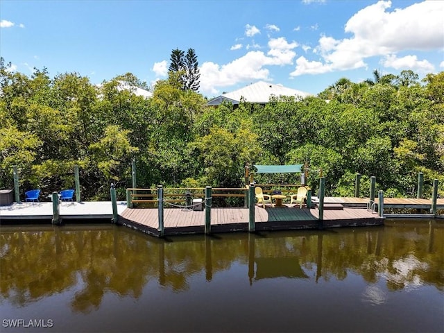 950 Moody Rd Unit 111, North Fort Myers, FL 33903 - dock area with a water view and view of scattered trees