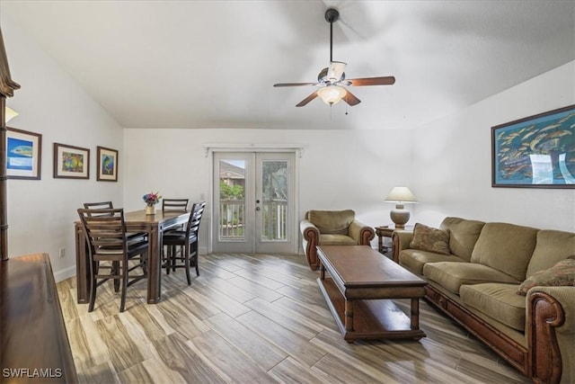 950 Moody Rd Unit 111, North Fort Myers, FL 33903 - living area featuring ceiling fan, french doors, light wood-type flooring, baseboards, and lofted ceiling