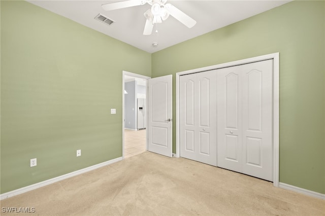 2305 Carnaby Ct, Lehigh Acres, FL 33973 - unfurnished bedroom with carpet flooring, baseboards, a closet, and ceiling fan