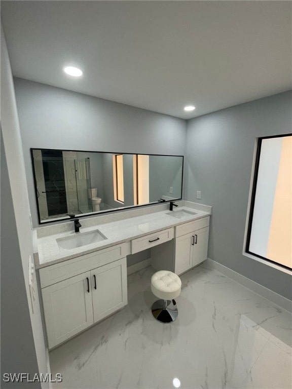 full bath with marble finish flooring, double vanity, recessed lighting, baseboards, and toilet