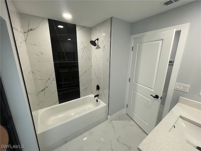 bathroom featuring bathtub / shower combination, marble finish flooring, recessed lighting, and vanity
