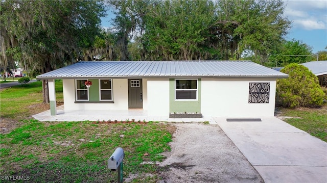 203 Carol Way, Fort Myers, FL 33905 - ranch-style home with covered porch, stucco siding, and metal roof