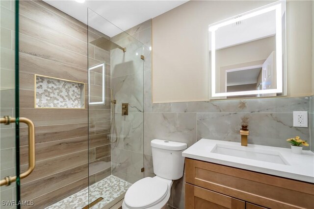 203 Carol Way, Fort Myers, FL 33905 - full bathroom with a shower stall, vanity, toilet, and tile walls