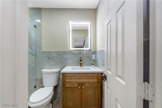 203 Carol Way, Fort Myers, FL 33905 - bathroom featuring tile walls, toilet, and vanity