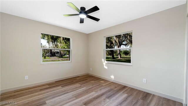 203 Carol Way, Fort Myers, FL 33905 - unfurnished room with light wood-style floors, baseboards, and a ceiling fan