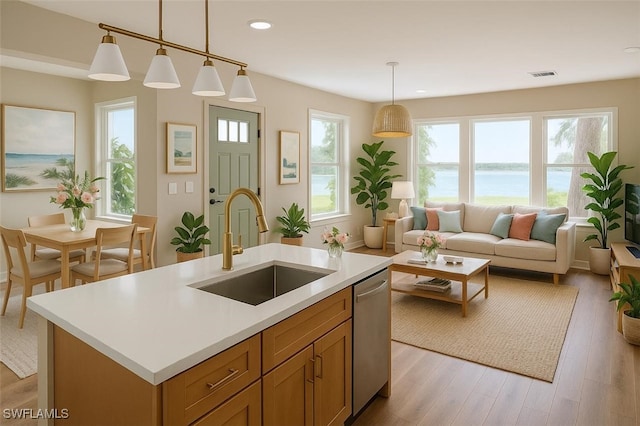 203 Carol Way, Fort Myers, FL 33905 - kitchen with a sink, light countertops, light wood finished floors, stainless steel dishwasher, and recessed lighting