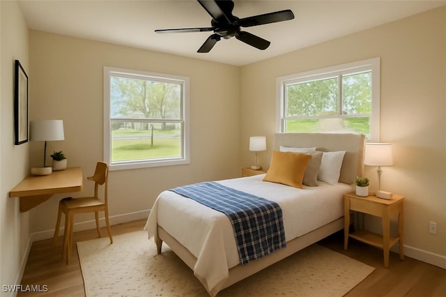 203 Carol Way, Fort Myers, FL 33905 - bedroom with baseboards, light wood-type flooring, and a ceiling fan