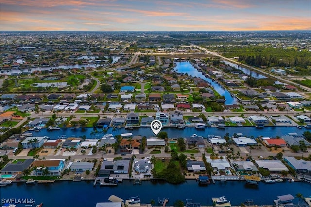 12206 Boat Shell Dr, Matlacha Isles, FL 33991 - aerial overview of property's location featuring a large body of water and nearby suburban area