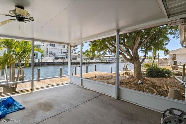 12206 Boat Shell Dr, Matlacha Isles, FL 33991 - unfurnished sunroom featuring a water view and ceiling fan