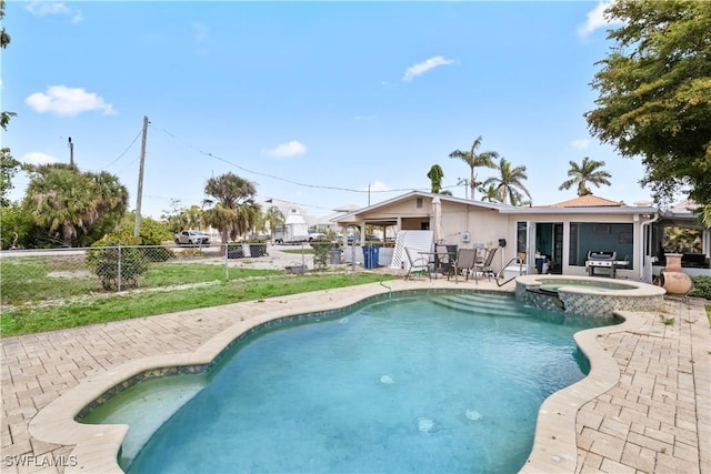 12206 Boat Shell Dr, Matlacha Isles, FL 33991 - view of pool with a patio area, a pool with connected hot tub, and area for grilling