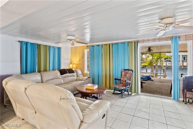 12206 Boat Shell Dr, Matlacha Isles, FL 33991 - living area with ceiling fan, light tile patterned floors, and a water view