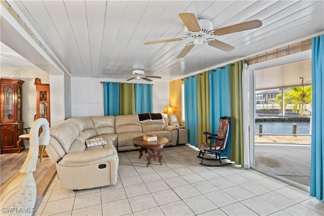 12206 Boat Shell Dr, Matlacha Isles, FL 33991 - living room with ceiling fan, light tile patterned floors, and wood ceiling