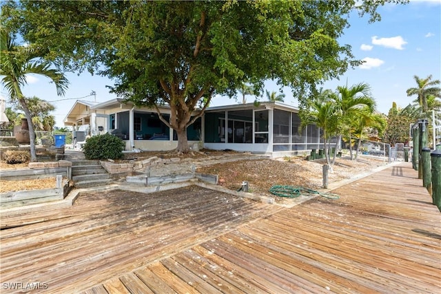 12206 Boat Shell Dr, Matlacha Isles, FL 33991 - wooden deck featuring a sunroom