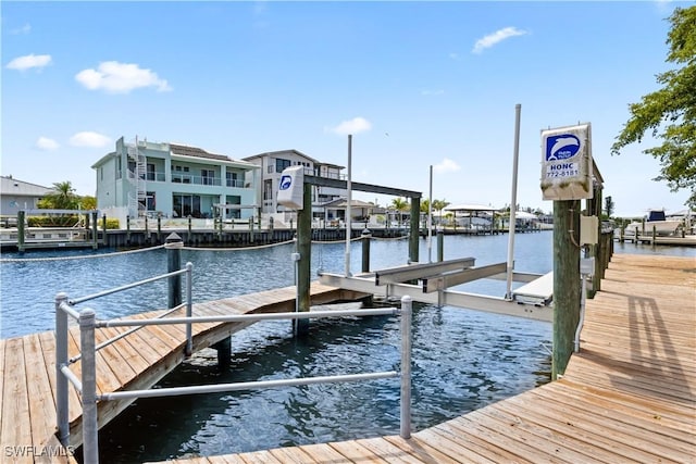 12206 Boat Shell Dr, Matlacha Isles, FL 33991 - dock featuring boat lift and a water view