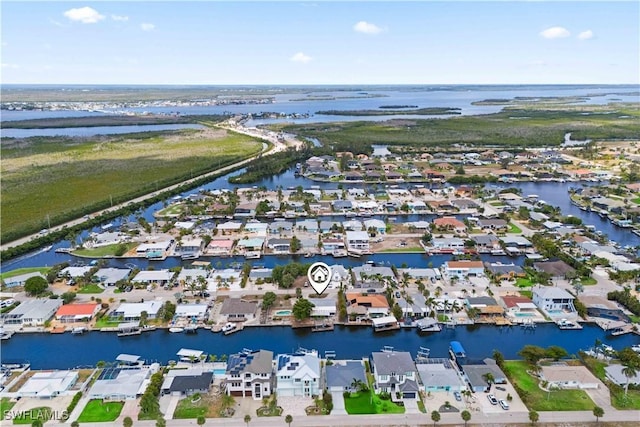12206 Boat Shell Dr, Matlacha Isles, FL 33991 - aerial overview of property's location with a nearby body of water and nearby suburban area