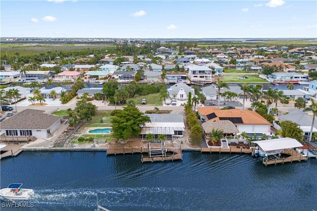 12206 Boat Shell Dr, Matlacha Isles, FL 33991 - aerial perspective of suburban area with a large body of water