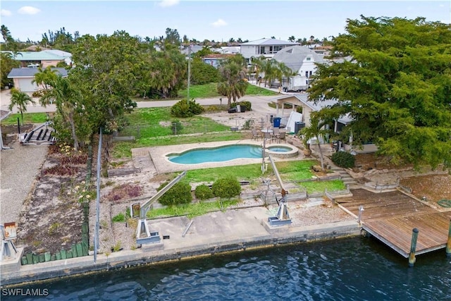 12206 Boat Shell Dr, Matlacha Isles, FL 33991 - aerial perspective of suburban area with a pool and a large body of water