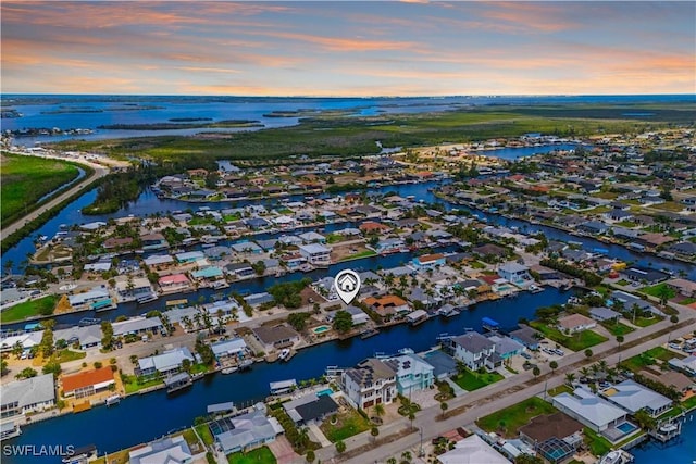 12206 Boat Shell Dr, Matlacha Isles, FL 33991 - aerial view of property's location with a nearby body of water and nearby suburban area