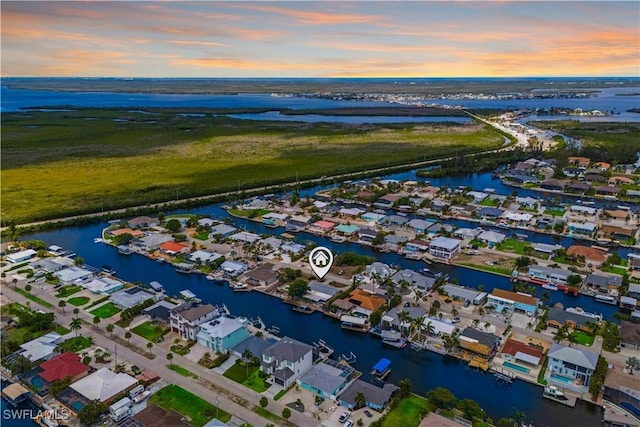 12206 Boat Shell Dr, Matlacha Isles, FL 33991 - aerial view of property's location with a large body of water and nearby suburban area